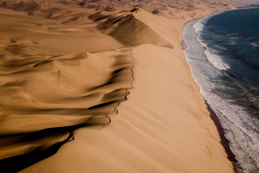 Walvis Bay and Sandwich Harbour Tour - Passing the salt refinery and pink ponds
