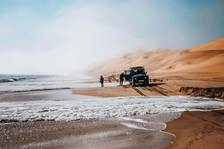 Walvis Bay: Dolphin Cruise, Pink Lakes and 4x4 Dune Drive - Lunch with sparkling wine in the dunes